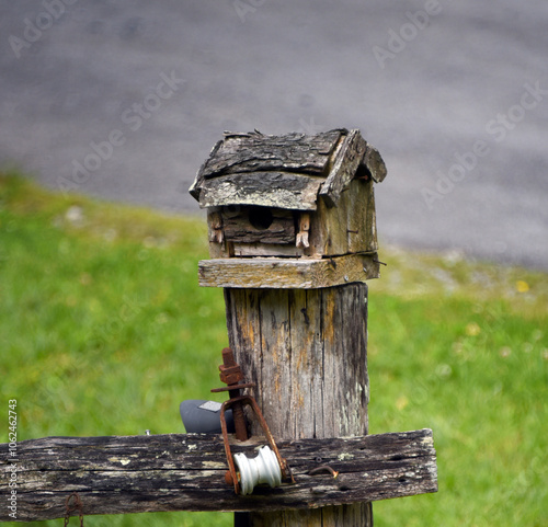 Bird House Designed Like a Log Cabin photo