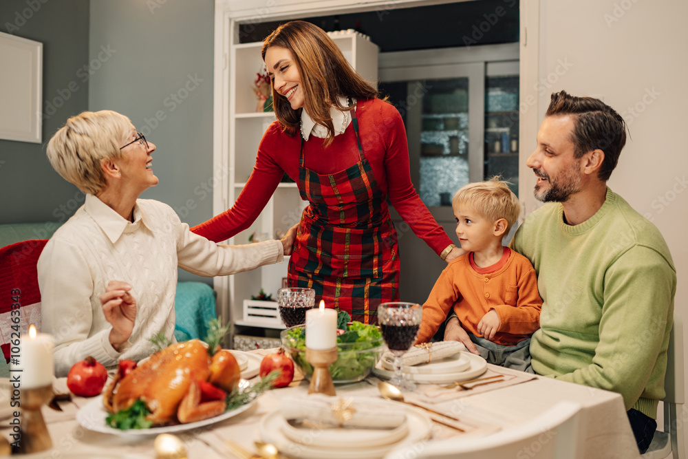 Happy family celebrating christmas together at home Happy family celebrating christmas together at home