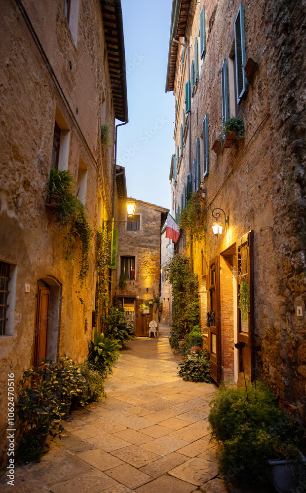 Beautiful street of tuscan Pienza town by night , Italy