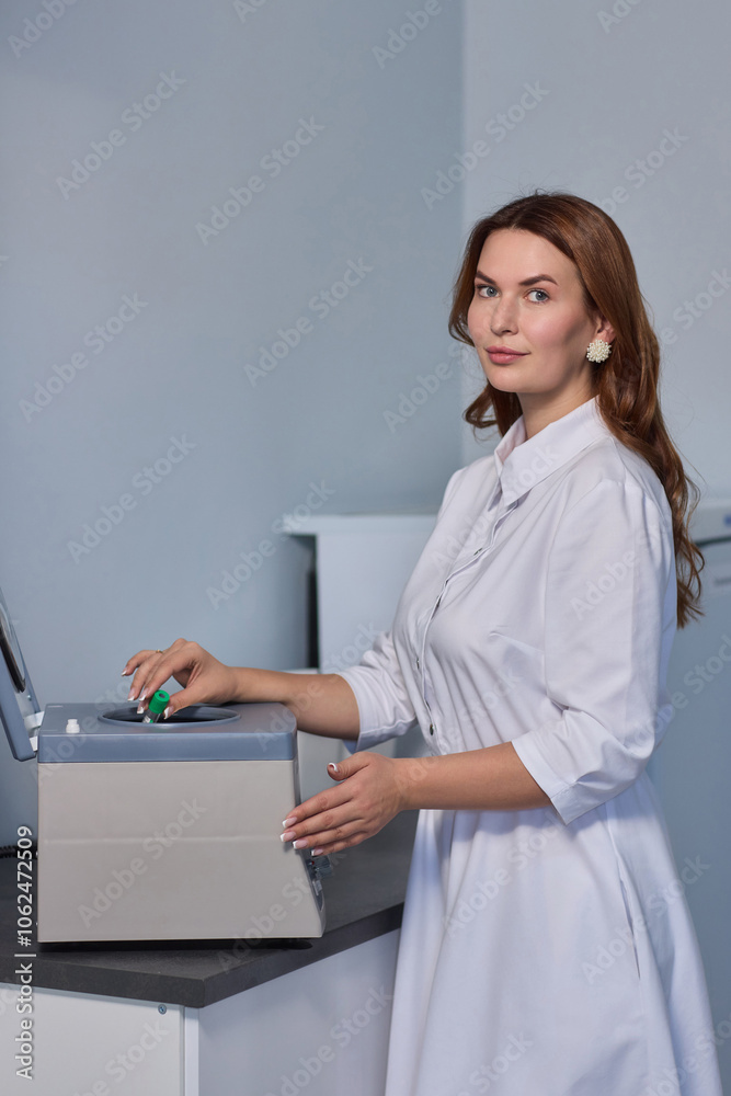 A Laboratory Centrifuge equipped with Blood Sample Tubes for scientific testing and analysis A Laboratory Centrifuge equipped with Blood Sample Tubes for scientific testing and analysis