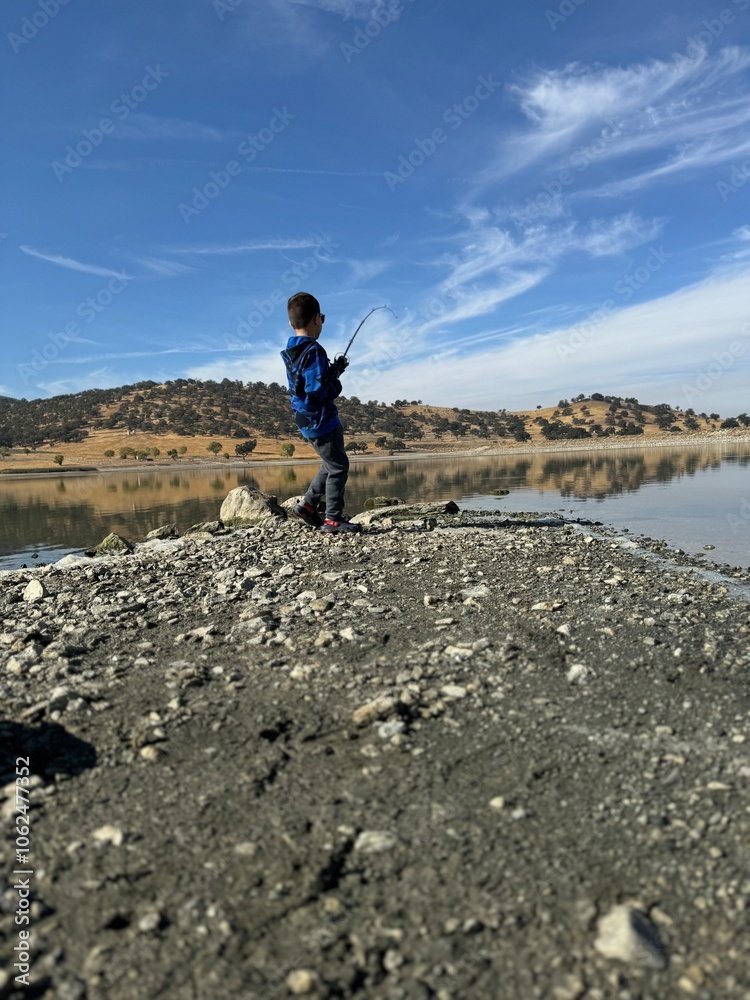 Boy fishing on the lake. Boy fishing on the lake.