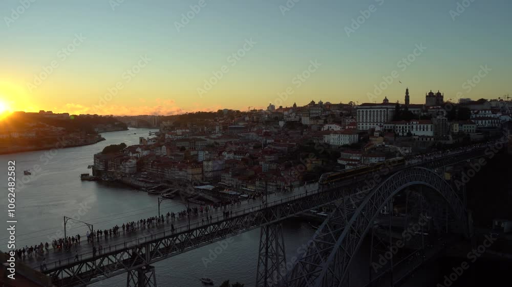 Porto City, Douro River and Dom Luis bridge I with Trams at Sunset. View from Tourist Viewpoint Miradouro da Serra do Pilar. Portugal Porto City, Douro River and Dom Luis bridge I with Trams at Sunset. View from Tourist Viewpoint Miradouro da Serra do Pilar. Portugal