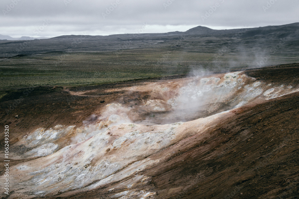 An open vulcanic area in Iceland with a steaming crator in different colors from white to brown An open vulcanic area in Iceland with a steaming crator in different colors from white to brown
