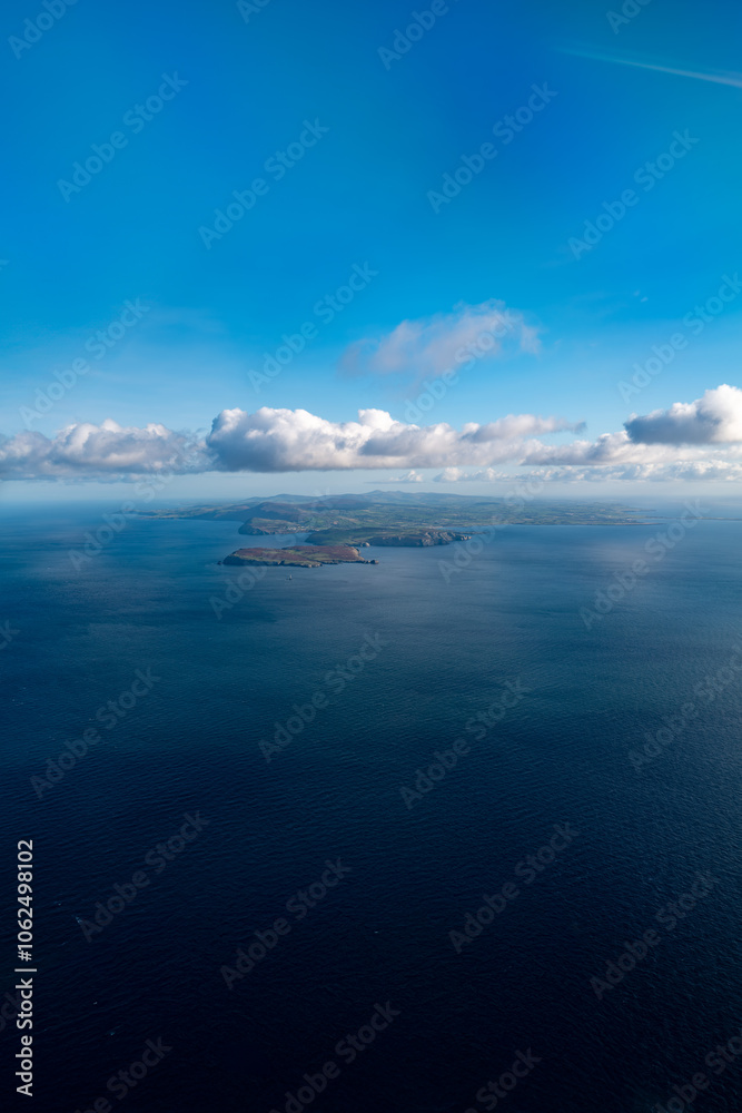 Aerial view looking up the Isle of Man from the south with scenic coastline and clouds - Portrait Aerial view looking up the Isle of Man from the south with scenic coastline and clouds - Portrait