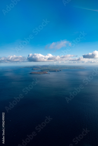 Wallpaper Mural Aerial view looking up the Isle of Man from the south with scenic coastline and clouds - Portrait Torontodigital.ca
