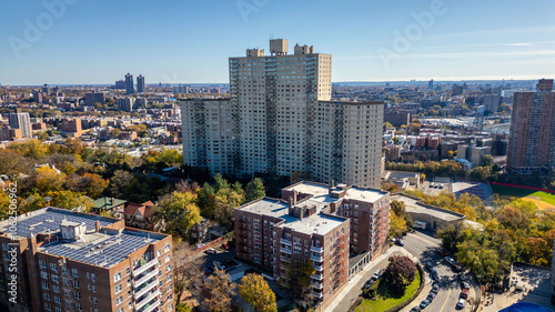 This location in the Bronx offers stunning views of lush greenery, a picturesque lake, and urban structures. Framed by the river, it showcases iconic bridges and the New York City skyline in the dista