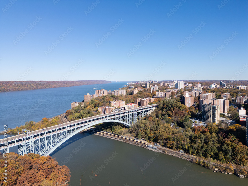 This location in the Bronx offers stunning views of lush greenery, a picturesque lake, and urban structures. Framed by the river, it showcases iconic bridges and the New York City skyline This location in the Bronx offers stunning views of lush greenery, a picturesque lake, and urban structures. Framed by the river, it showcases iconic bridges and the New York City skyline