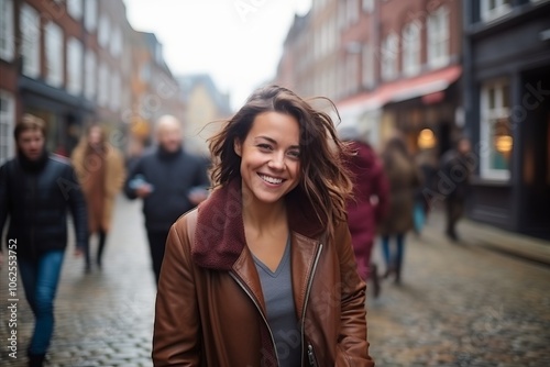 Portrait of a beautiful young woman walking in the city center.