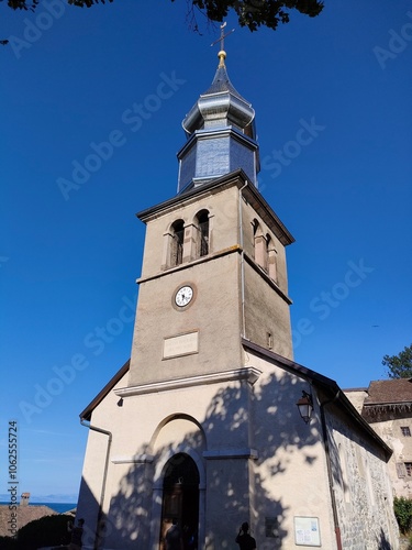 A historical clock tower set against a clear blue sky, representing timelessness, architectural beauty, and the passage of time in a captivating manner.