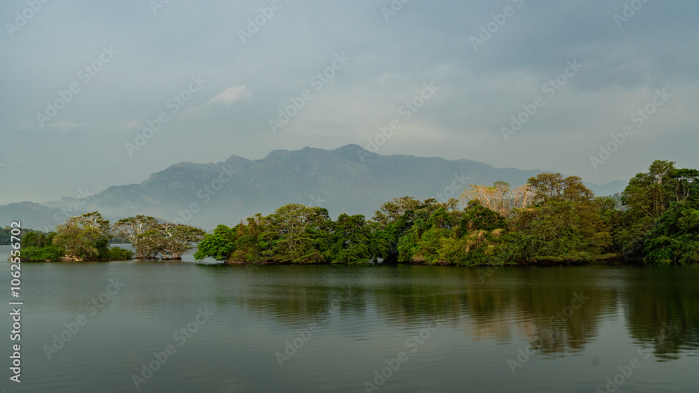 panoramic landscape view of clouds and forest reflecting on the water panoramic landscape view of clouds and forest reflecting on the water