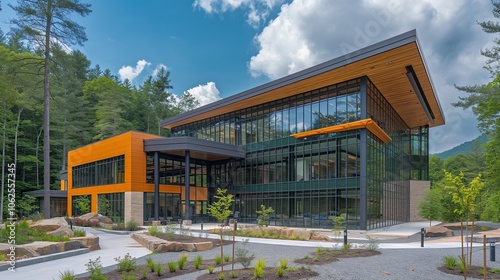 Modern office building with glass facade and landscaped courtyard.