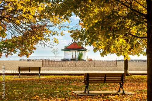 Photography Beach and white wooden lifeguard station with park benches, wooden boardwalk  an