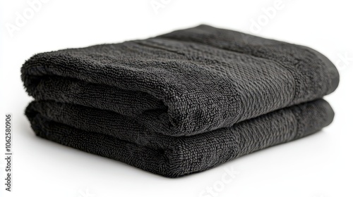 Folded black hand towel isolated on white background