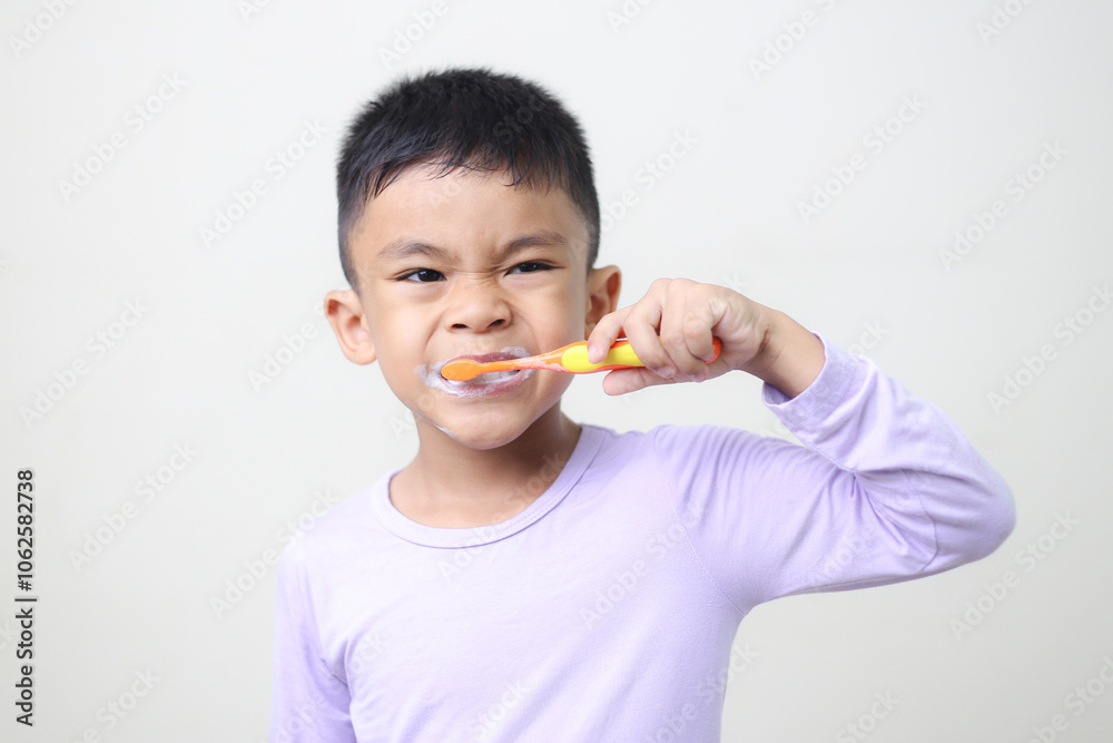 child Asia kid boy brushing teeth isolated on white backgroud. child Asia kid boy brushing teeth isolated on white backgroud.