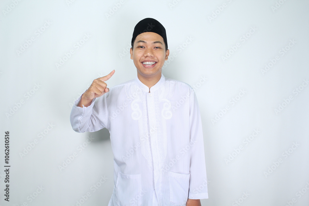 cheerful muslim asian man pointing to him self with smiling at camera, show its me gesture, isolated on white background cheerful muslim asian man pointing to him self with smiling at camera, show its me gesture, isolated on white background