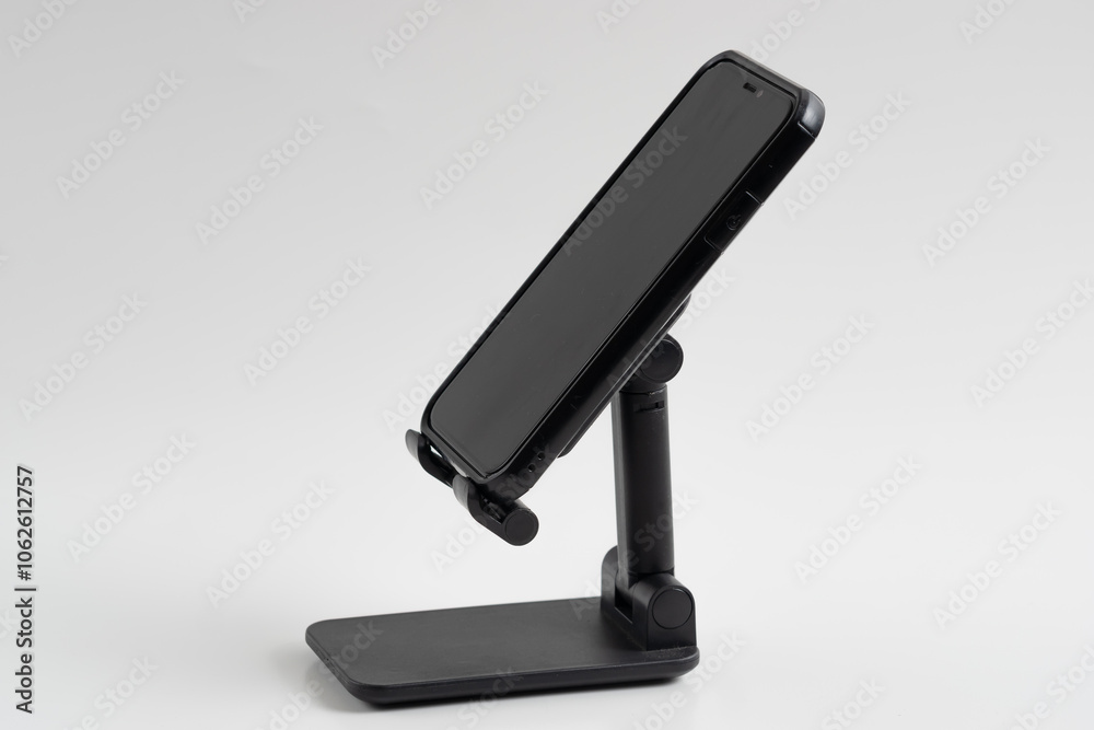 Phone holder stand that can be adjusted to height angle isolated on white background. holder for phone, phone stand, mount, universal Phone holder stand that can be adjusted to height angle isolated on white background. holder for phone, phone stand, mount, universal