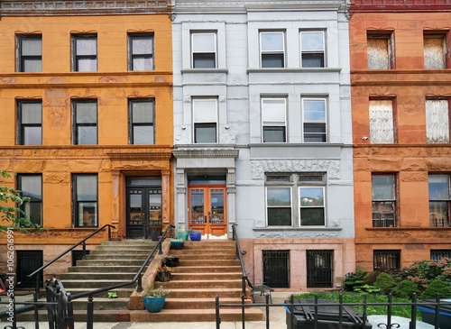 Photography Old brownstone style apartment buildings or townhouses in New York City