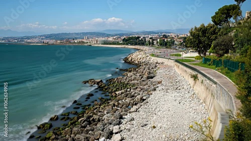 Wallpaper Mural Rocky Shoreline with Cityscape and Mountains in Background. Torontodigital.ca