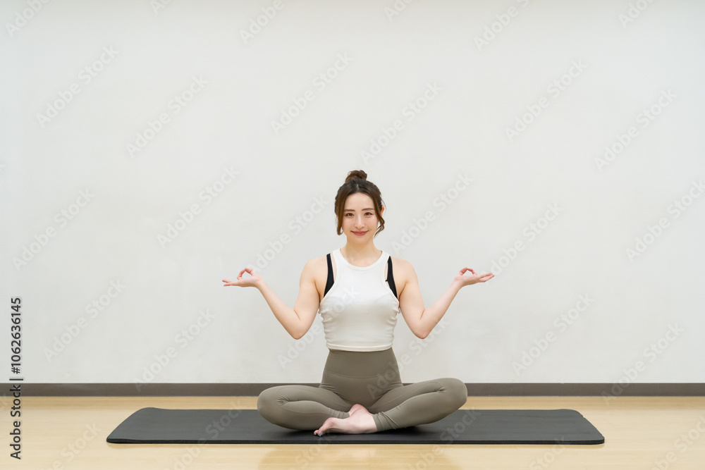 young asian beauty woman doing yoga at studio