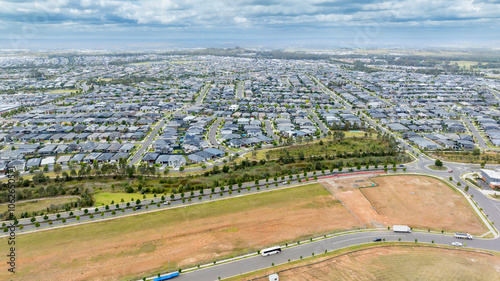 Photography Drone aerial photograph of houses and infrastructure development in the fast growing suburb of Oran Park in the high density development region of western Sydney, NSW Australia