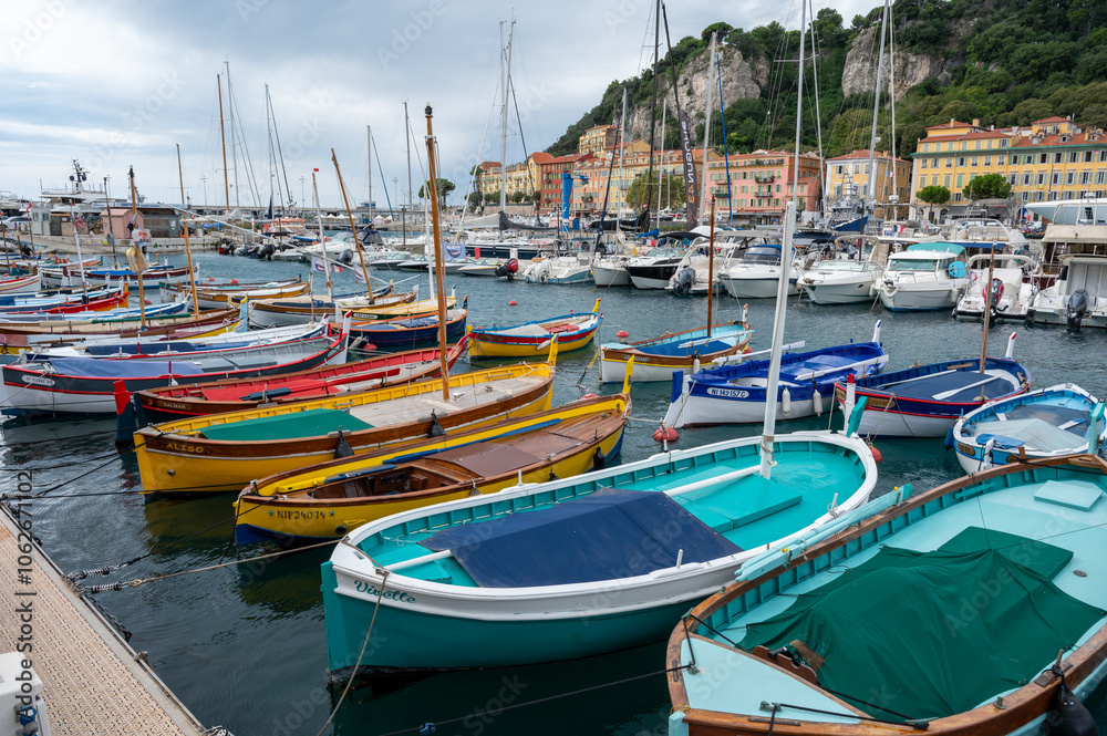 Obraz premium Traditional colorful fishing boats, called pointu in French. in Nice Port, Nice, France on sunny summer day.