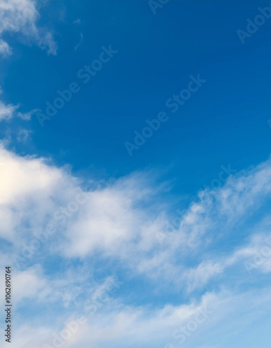 Serene Sky: A canvas of azure blue, adorned with wispy white clouds, evoking tranquility and peace.