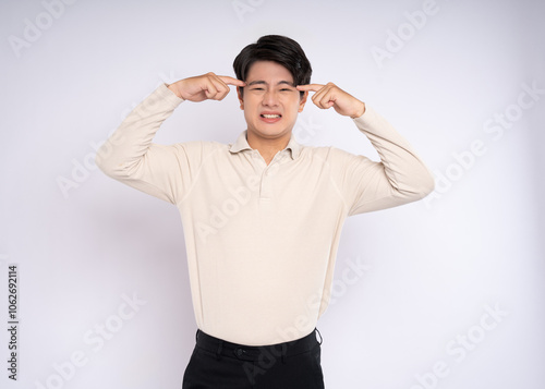 Portrait of young asian businessman wearing sweater and posing on white background