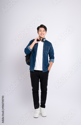 adult, advertisement, asian, background, backpack, casual, cheerful, chinese, confidence, cool, denim jacket, fashion, filipinos, formal, friendly, full, full body, gesture, happiness, happy, headphon photo