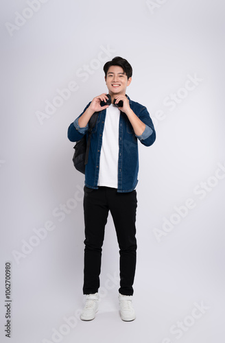 adult, advertisement, asian, background, backpack, casual, cheerful, chinese, confidence, cool, denim jacket, fashion, filipinos, formal, friendly, full, full body, gesture, happiness, happy, headphon photo