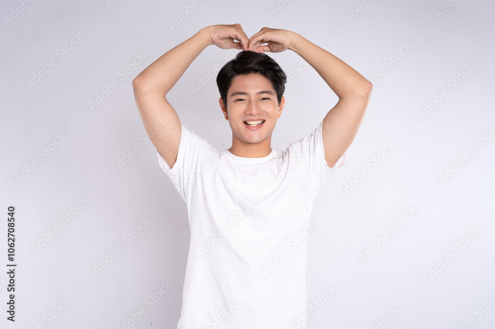 Portrait of an Asian guy posing on a white background Portrait of an Asian guy posing on a white background