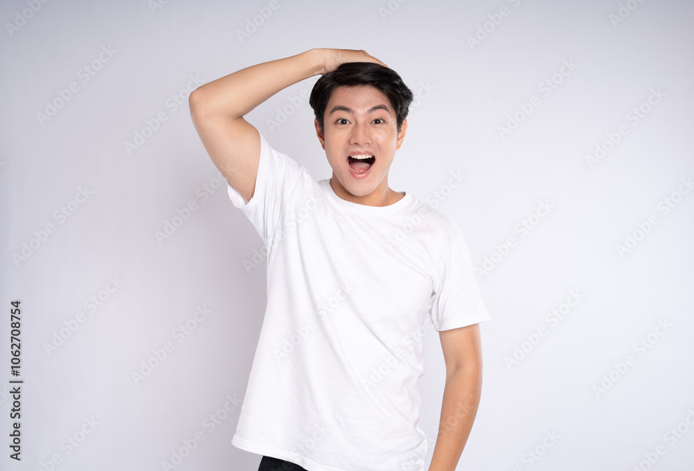 Portrait of an Asian guy posing on a white background Portrait of an Asian guy posing on a white background