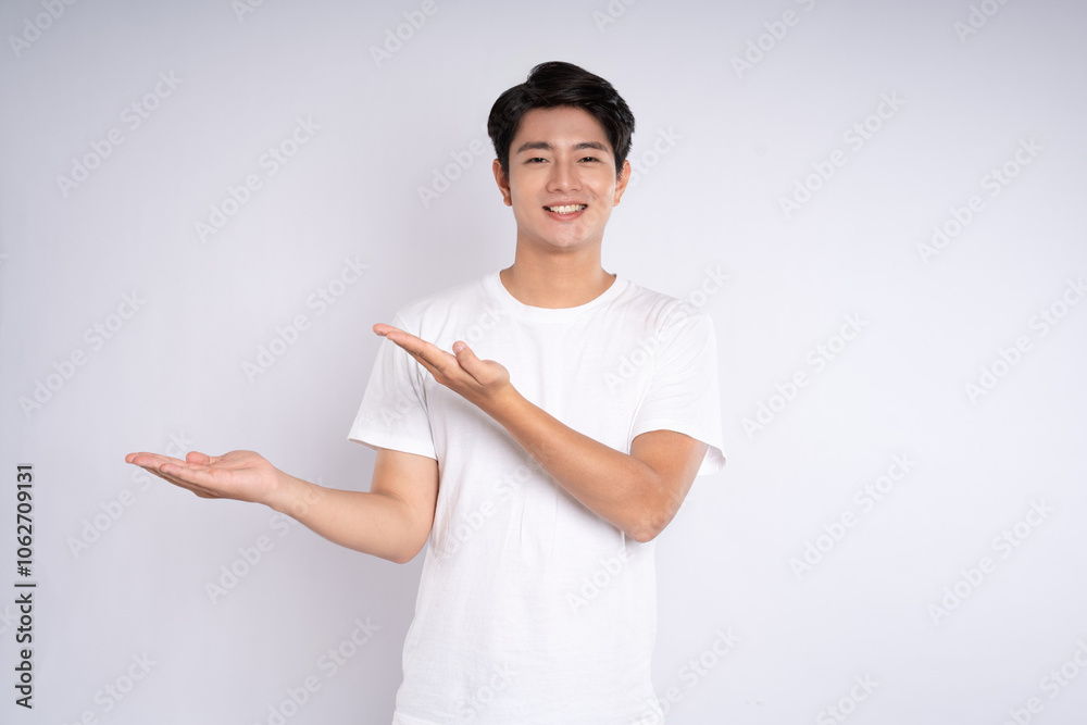 Portrait of an Asian guy posing on a white background