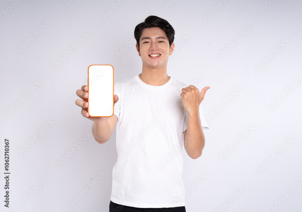 Portrait of young asian man using phone on white background
Portrait of young asian man using phone on white background