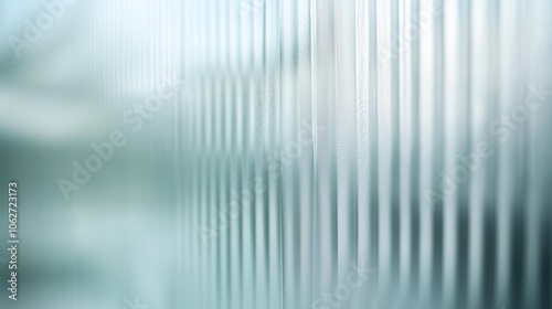 Delicate, translucent glass with gentle reeded patterns, evoking simplicity and sophistication.