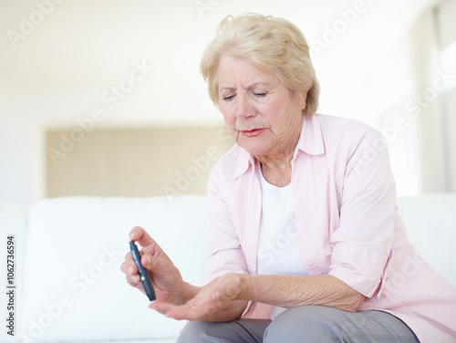 Woman, home and senior patient with diabetes for injection, sick or pen on finger in elderly care. Mature person, pensioner or medical tool with diabetic needle prick, illness and chronic disease