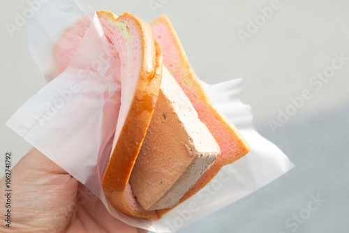 Hand holding Singapore style sandwich ice cream