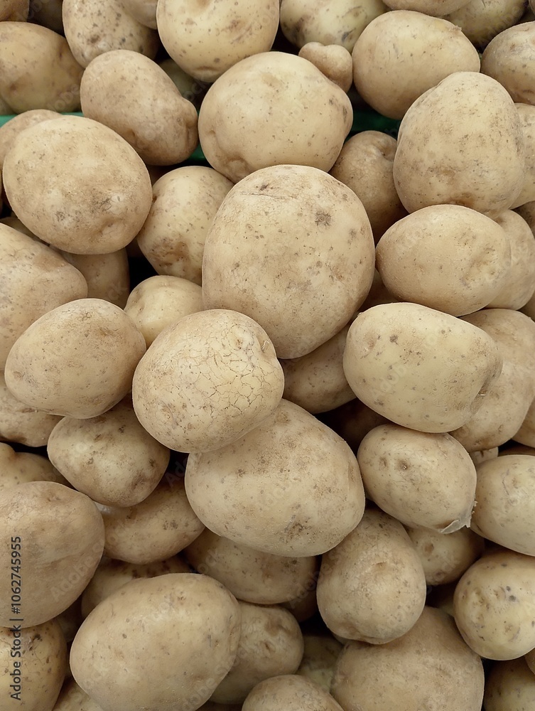 Raw potato food. Abstract shapes, patterns and textures of piles of potatoes. Potatoes look clean and fresh. For graphic design or banner background. Harvest potatoes. Raw potato food. Abstract shapes, patterns and textures of piles of potatoes. Potatoes look clean and fresh. For graphic design or banner background. Harvest potatoes.