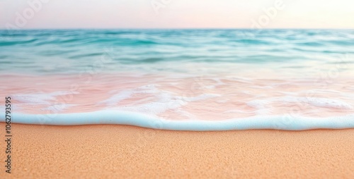 Serene beach with gentle waves lapping at the golden sand shore.