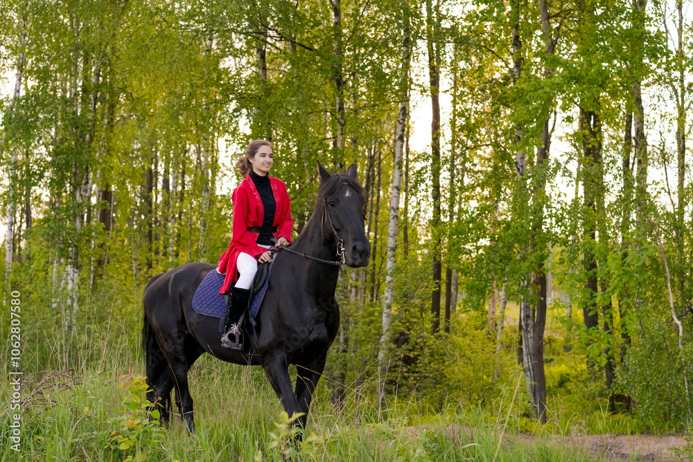 Woman is riding a horse in a forest Woman is riding a horse in a forest