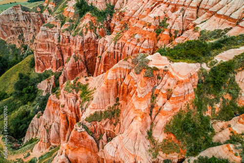 Red rocky slopes Rapa Rosie is a protected geological and floristic reservation area near Sebes alba in Romania photo