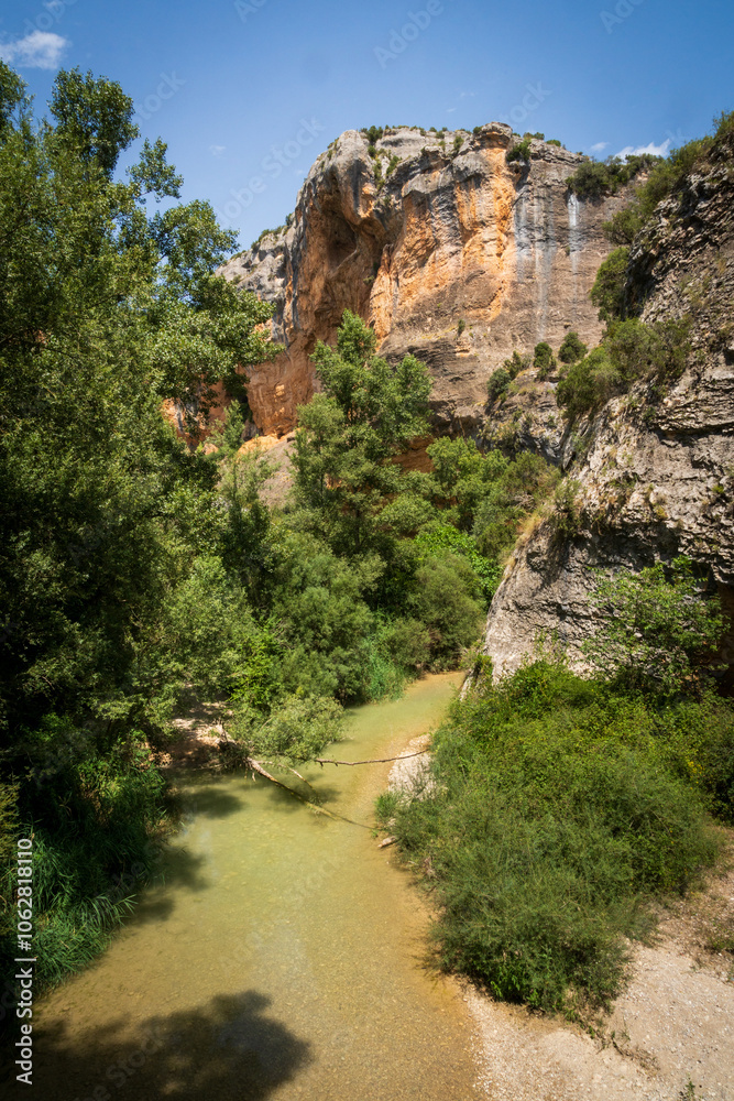 Pasarelas del Vero, walkways and footbridges along a scenic gorge with turquoise water in Alquézar, Huesca, Spain Pasarelas del Vero, walkways and footbridges along a scenic gorge with turquoise water in Alquézar, Huesca, Spain