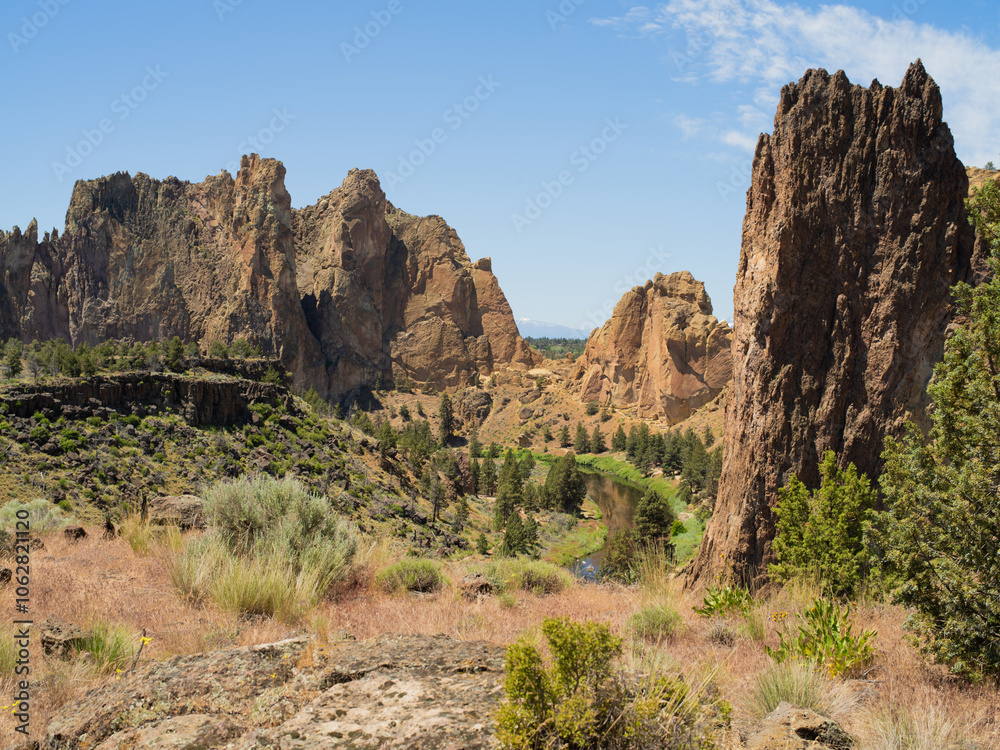 A mountain range with a river running through it A mountain range with a river running through it