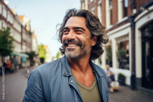 Portrait of a smiling middle-aged man in a city street