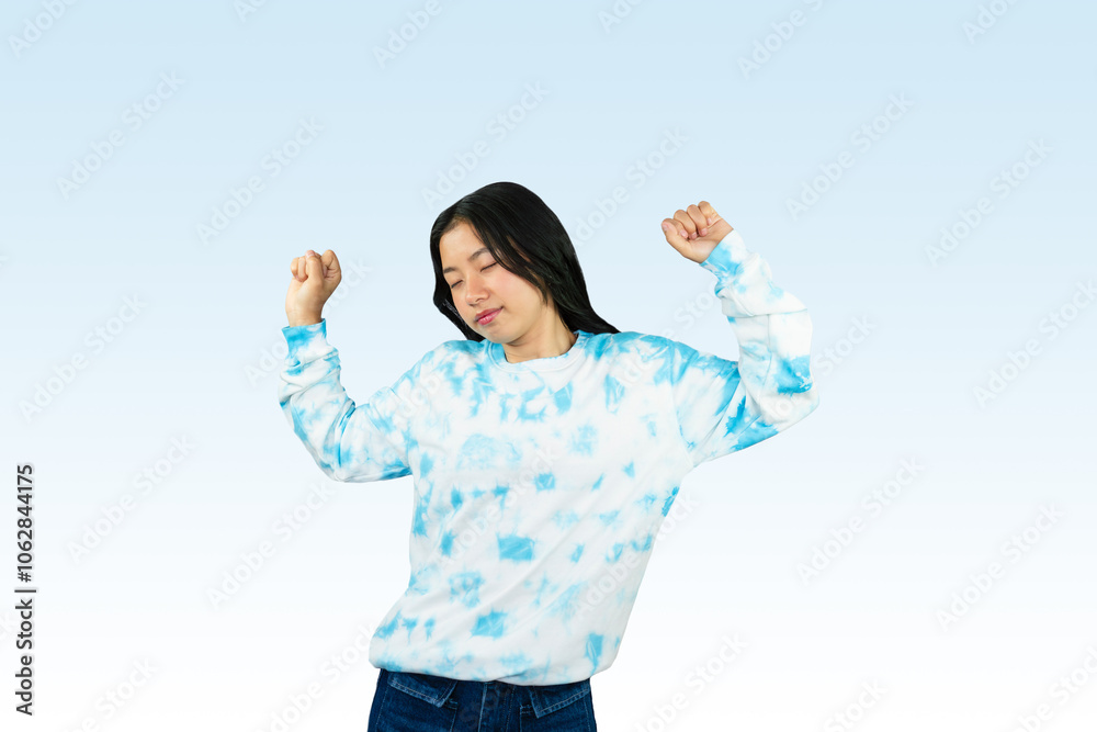 Obraz premium Yougn Asian girl with blue dress points and gives various expression and gestures isolated happy sad