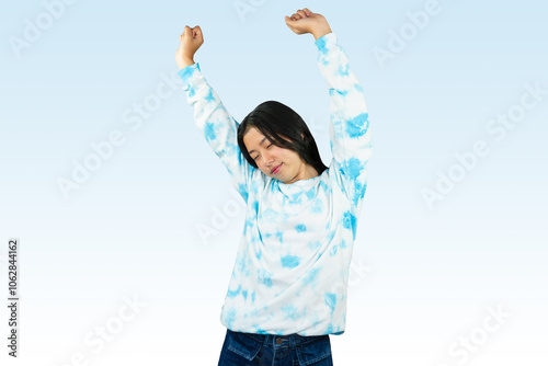 Yougn Asian girl with blue dress points and gives various expression and gestures isolated happy sad photo