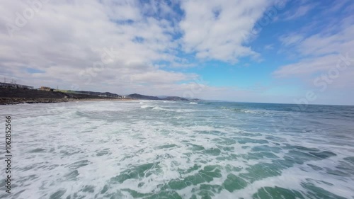 FPV Drone View of Surfable Beach in Pohang, South Korea photo