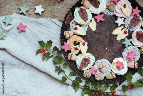 Assortment of Christmas Cookies and Marzipan in Festive Shapes photo