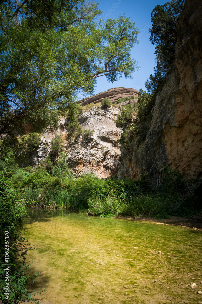 Pasarelas del Vero, walkways and footbridges along a scenic gorge with turquoise water in Alquézar, Huesca, Spain Pasarelas del Vero, walkways and footbridges along a scenic gorge with turquoise water in Alquézar, Huesca, Spain