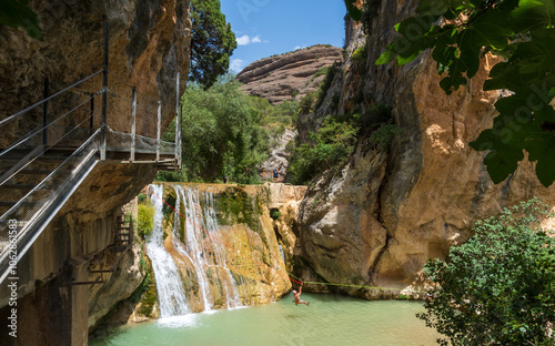 Pasarelas del Vero, walkways and footbridges along a scenic gorge with turquoise water in Alquézar, Huesca, Spain