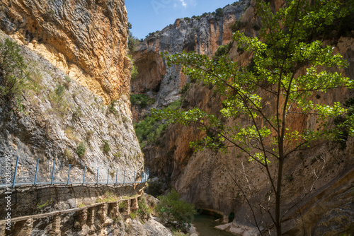 Pasarelas del Vero, walkways and footbridges along a scenic gorge with turquoise water in Alquézar, Huesca, Spain photo